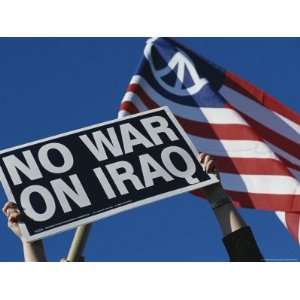  Sign Protesting the War in Iraq and an American Peace Flag 