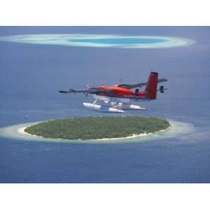 Maldivian Air Taxi Flying Above Island, Maldives, Indian Ocean, Asia 