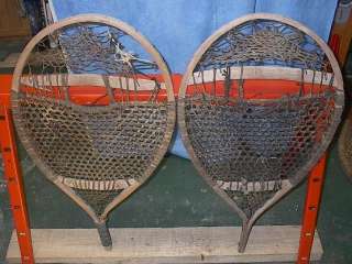 lot of snowshoes toboggans skis paddles and oars listed with a wide 