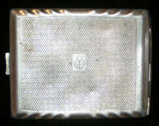 The cigarette case made from light metal (looks as aluminum) in light 