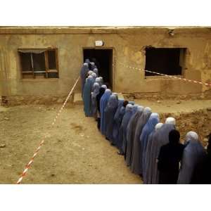  Afghan Women Wearing Burqa Line up to Vote at a Polling 