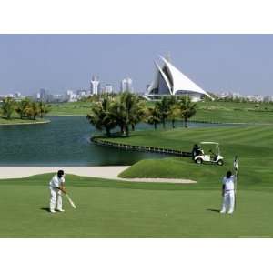 Men on Dubai Creek Golf with Yacht Club in Distance, Dubai 