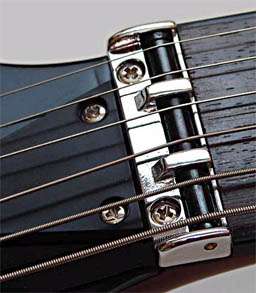   the strings run parallel straight from the nut to the tuning machines